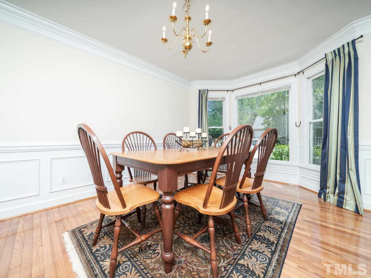 9101 Cub Trail Raleigh, NC 27615 - Photo 6 of 22 a view of a dining room with furniture window and wooden floor