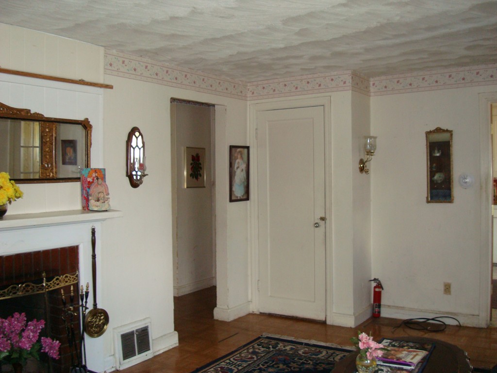 125 Ashbrook Street Springfield, MA 01118 - Photo 3 of 11 a living room with furniture and a fireplace
