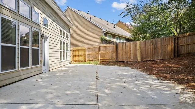 a view of a house with backyard and a garage