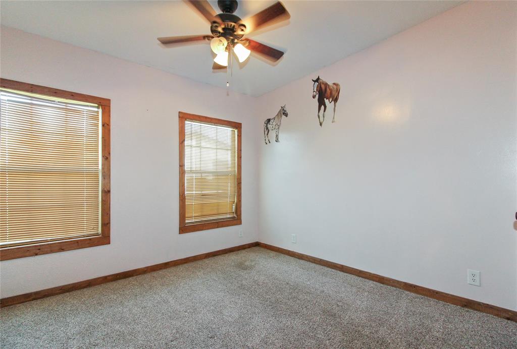 455 Hughes Cemetery Road Italy, TX 76651 - Photo 29 of 40 an empty room with windows and fan