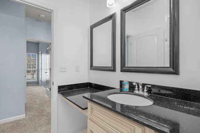 wooden floor in an empty room with a ceiling fan