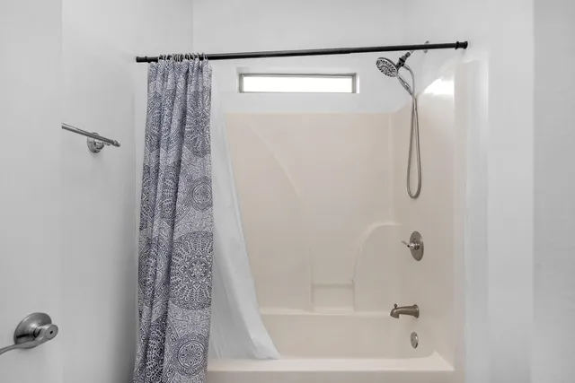 an empty room with a empty space and a window