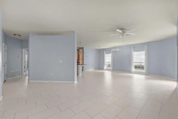 a bathroom with a granite countertop double vanity sink and a mirror