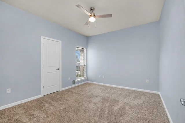 a bathroom with a bath tub with a shower