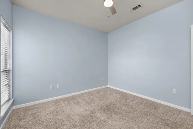 a street view with wooden fence