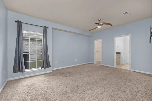 a view of a house with snow on the road