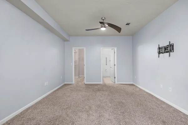 a view of residential houses with yard and mountain view in back