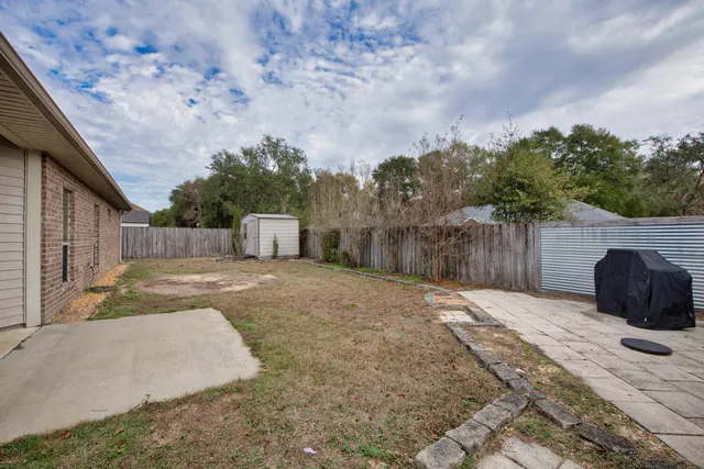 an aerial view of a house with a swimming pool