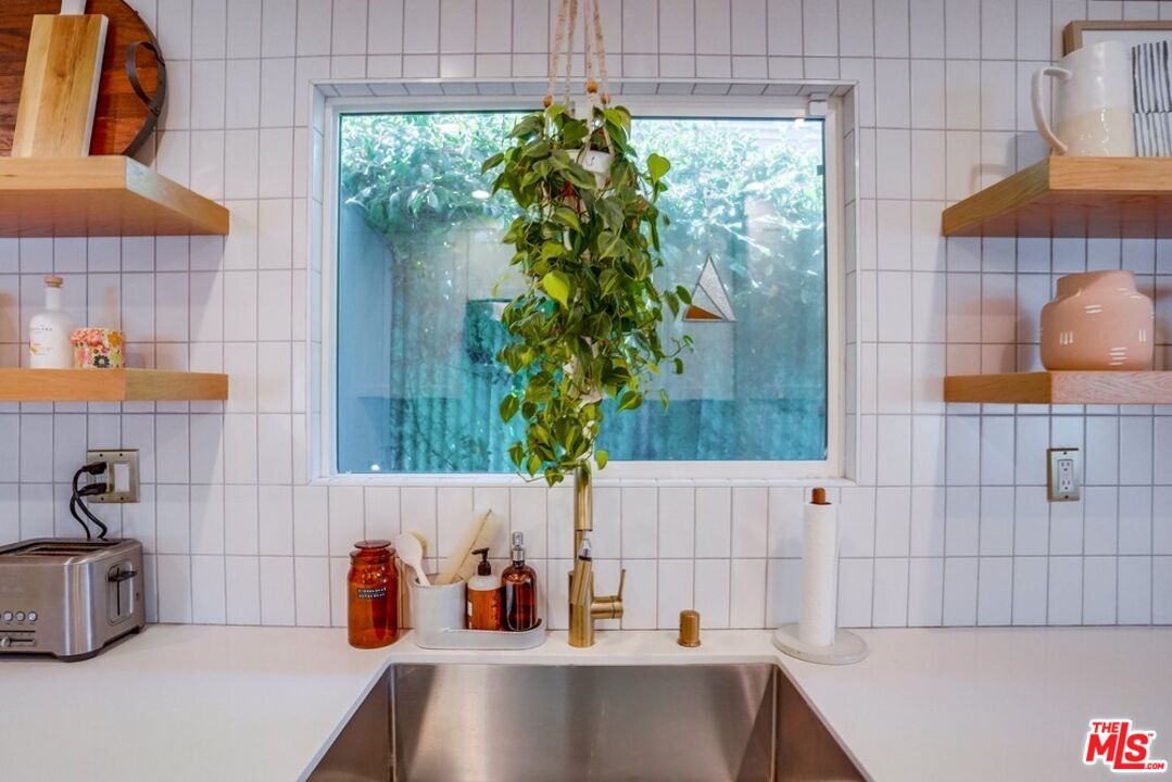 6116 Springvale Drive Los Angeles, CA 90042 - Photo 12 of 33 a bathroom with a tub and sink