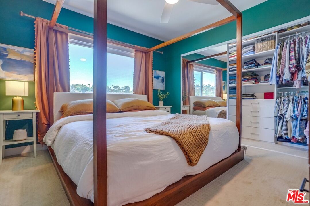 6116 Springvale Drive Los Angeles, CA 90042 - Photo 14 of 33 a bedroom with a large bed and a large window