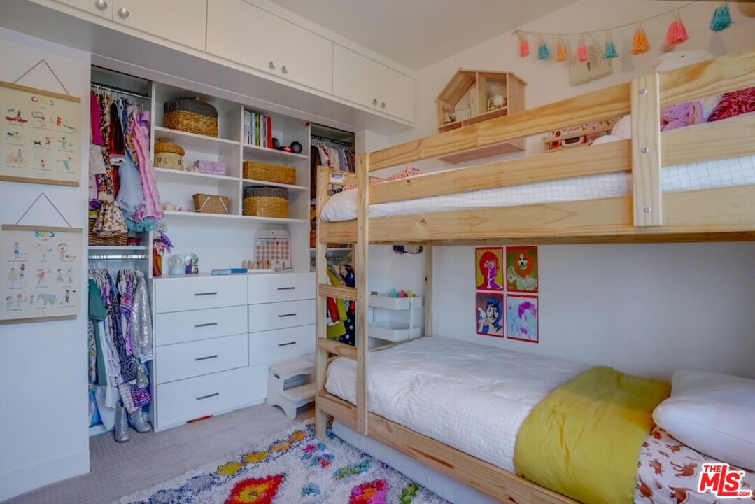 6116 Springvale Drive Los Angeles, CA 90042 - Photo 18 of 33 a bed room with a bed and a closet
