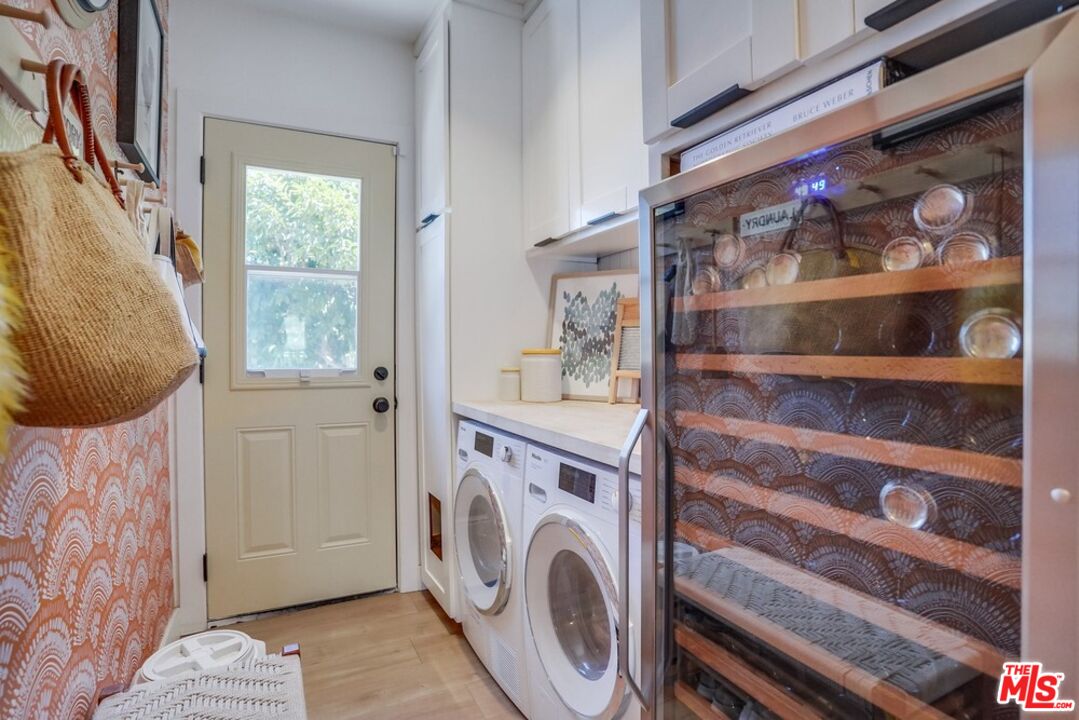 6116 Springvale Drive Los Angeles, CA 90042 - Photo 20 of 33 a view of a storage & utility room with washer and dryer
