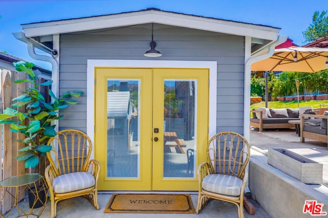 6116 Springvale Drive Los Angeles, CA 90042 - Photo 30 of 33 a balcony with furniture and a potted plant