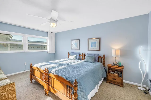 a bedroom with a bed and a table in it