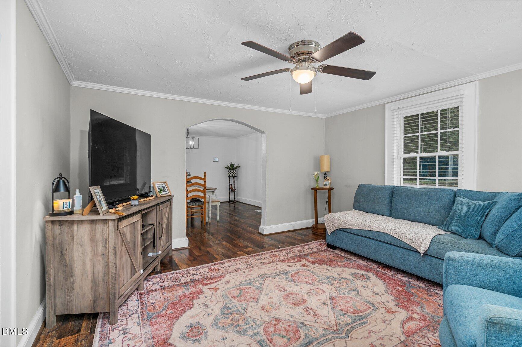 111 South May Street Spring Hope, NC 27882 - Photo 19 of 25 a living room with furniture and a flat screen tv