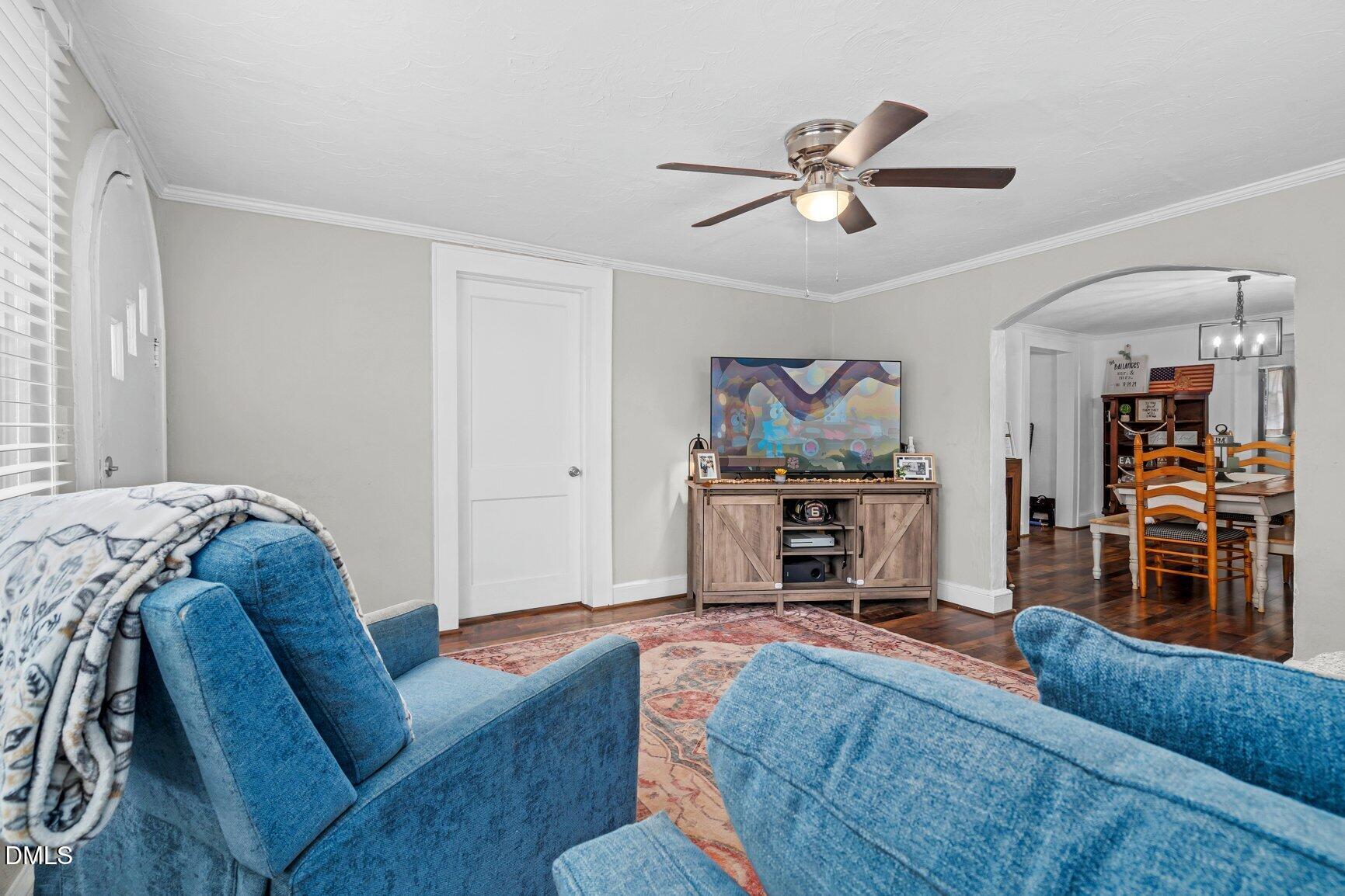 111 South May Street Spring Hope, NC 27882 - Photo 22 of 25 a living room with furniture and a flat screen tv