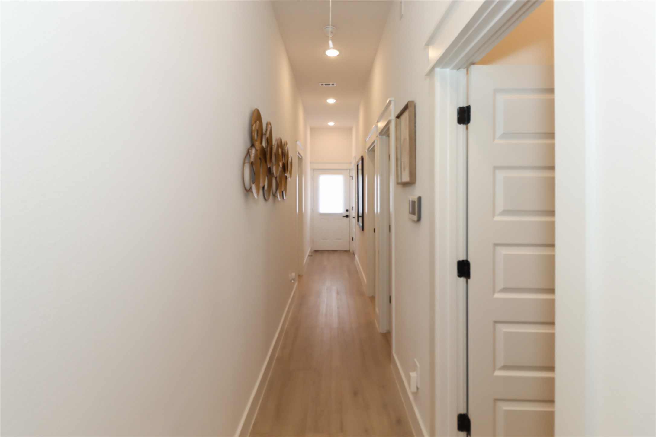 4902 Higgins Street, Unit B Houston, TX 77033 - Photo 14 of 39 a view of a hallway with wooden floor and a bathroom