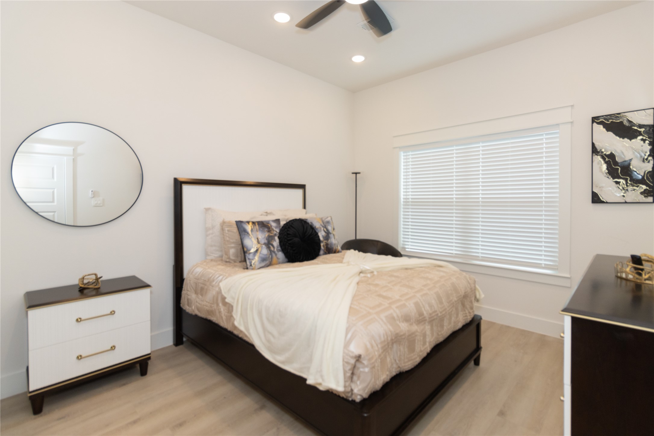 4902 Higgins Street, Unit B Houston, TX 77033 - Photo 17 of 39 a bedroom with a bed and a dresser