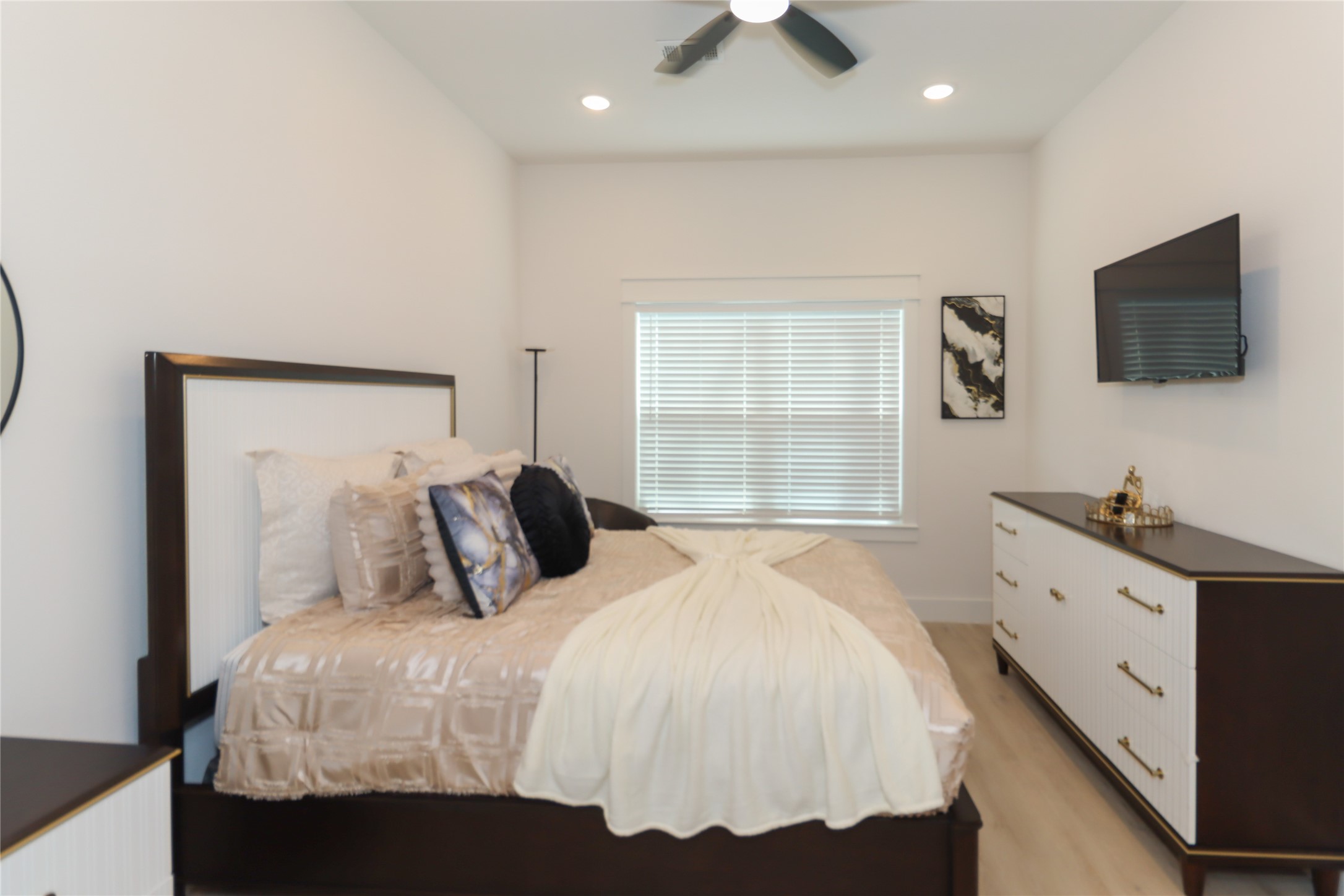 4902 Higgins Street, Unit B Houston, TX 77033 - Photo 18 of 39 a bedroom with a bed and a flat screen tv