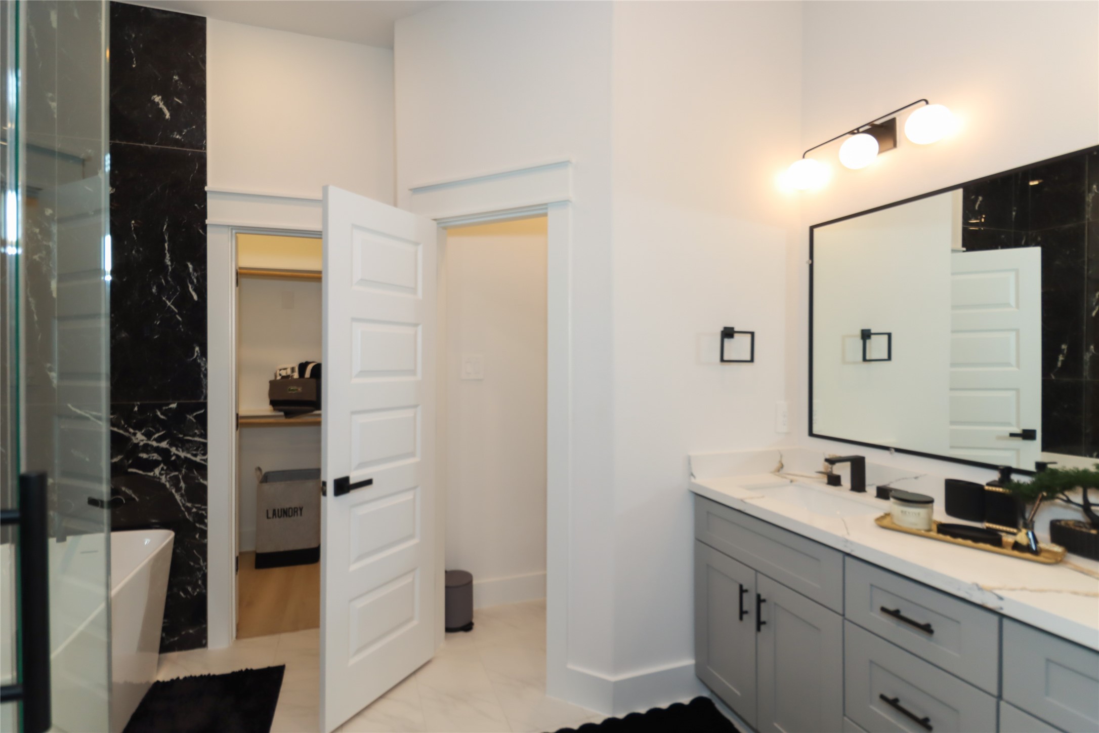 4902 Higgins Street, Unit B Houston, TX 77033 - Photo 22 of 39 a bathroom with a double vanity sink a and mirror