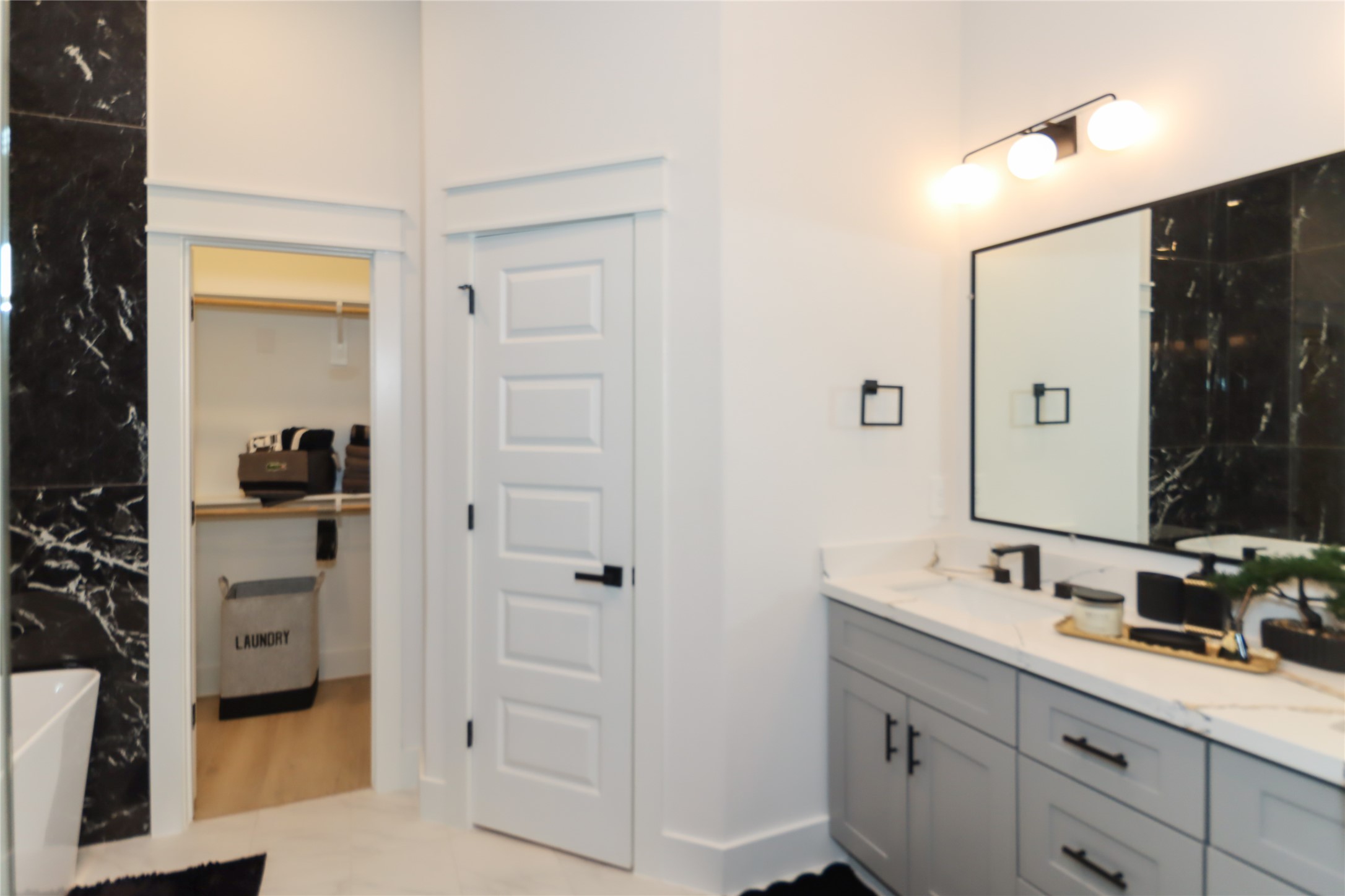 4902 Higgins Street, Unit B Houston, TX 77033 - Photo 23 of 39 a bathroom with a shower sink and mirror