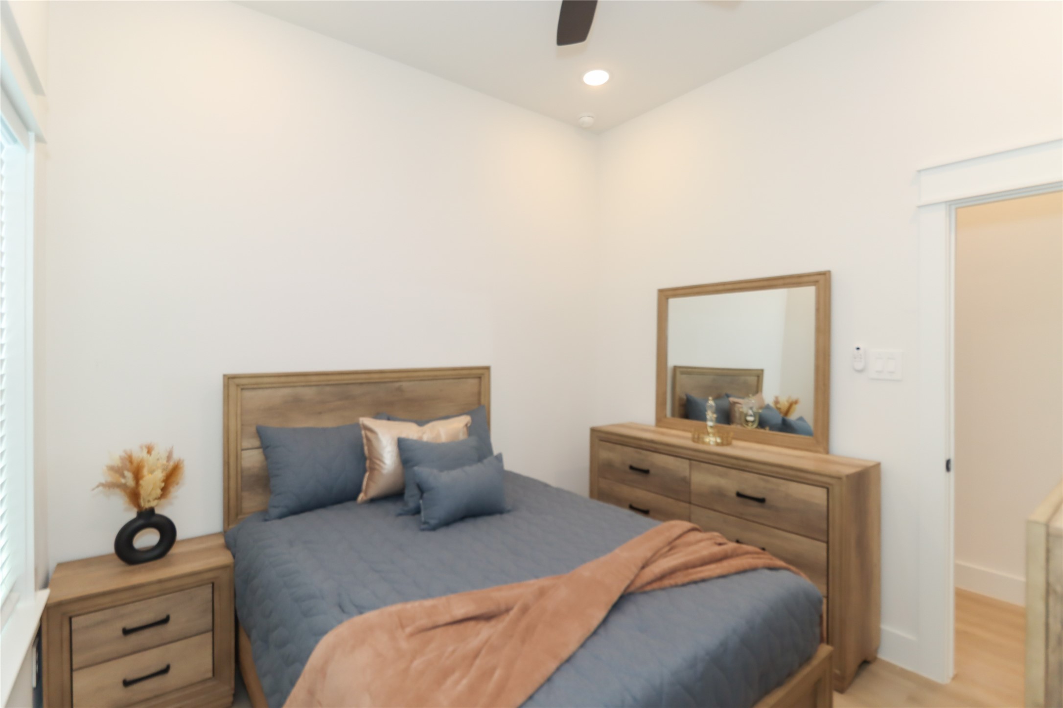 4902 Higgins Street, Unit B Houston, TX 77033 - Photo 27 of 39 a bedroom with a bed and a dresser