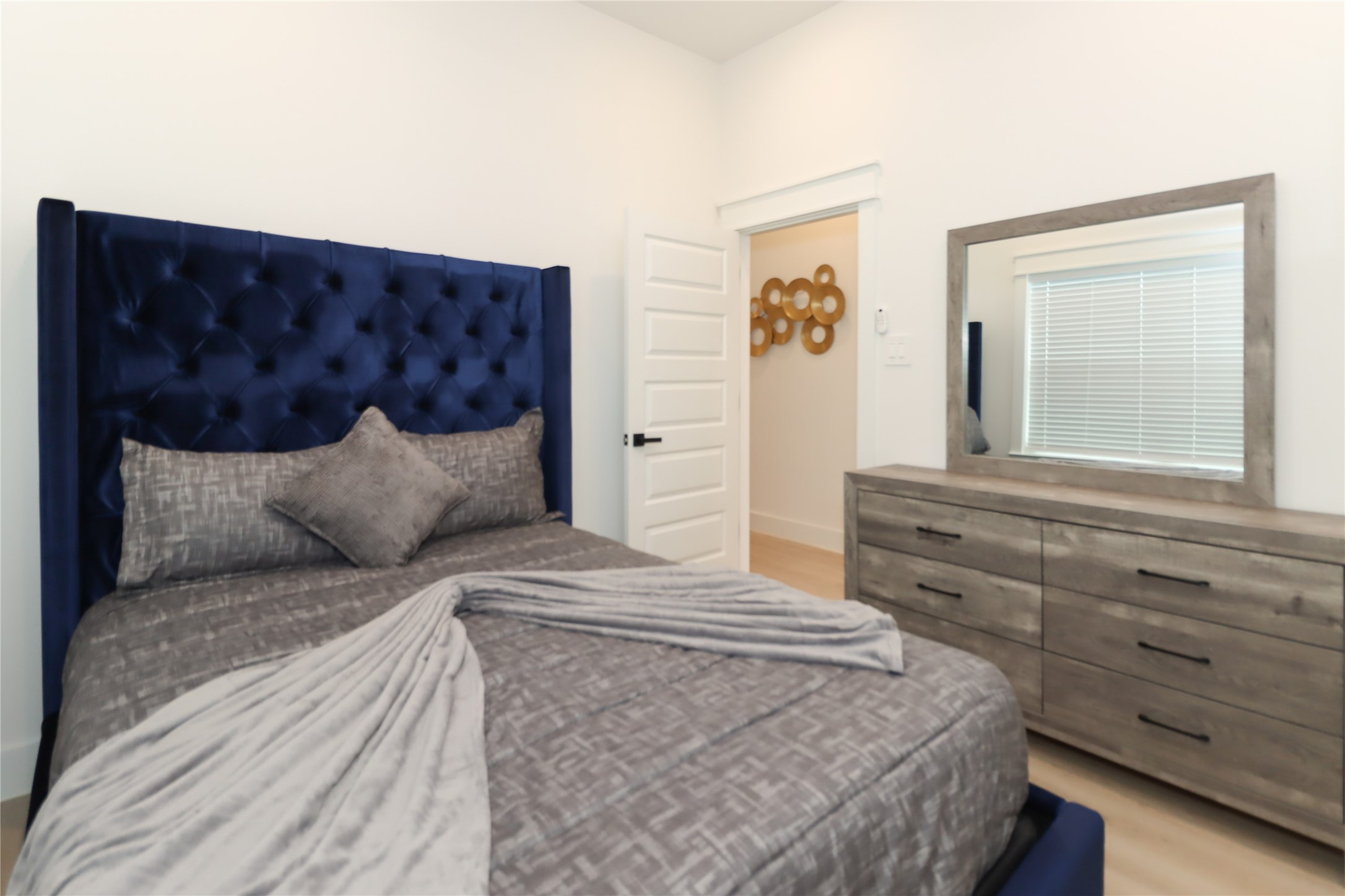 4902 Higgins Street, Unit B Houston, TX 77033 - Photo 29 of 39 a bedroom with a bed and a dresser