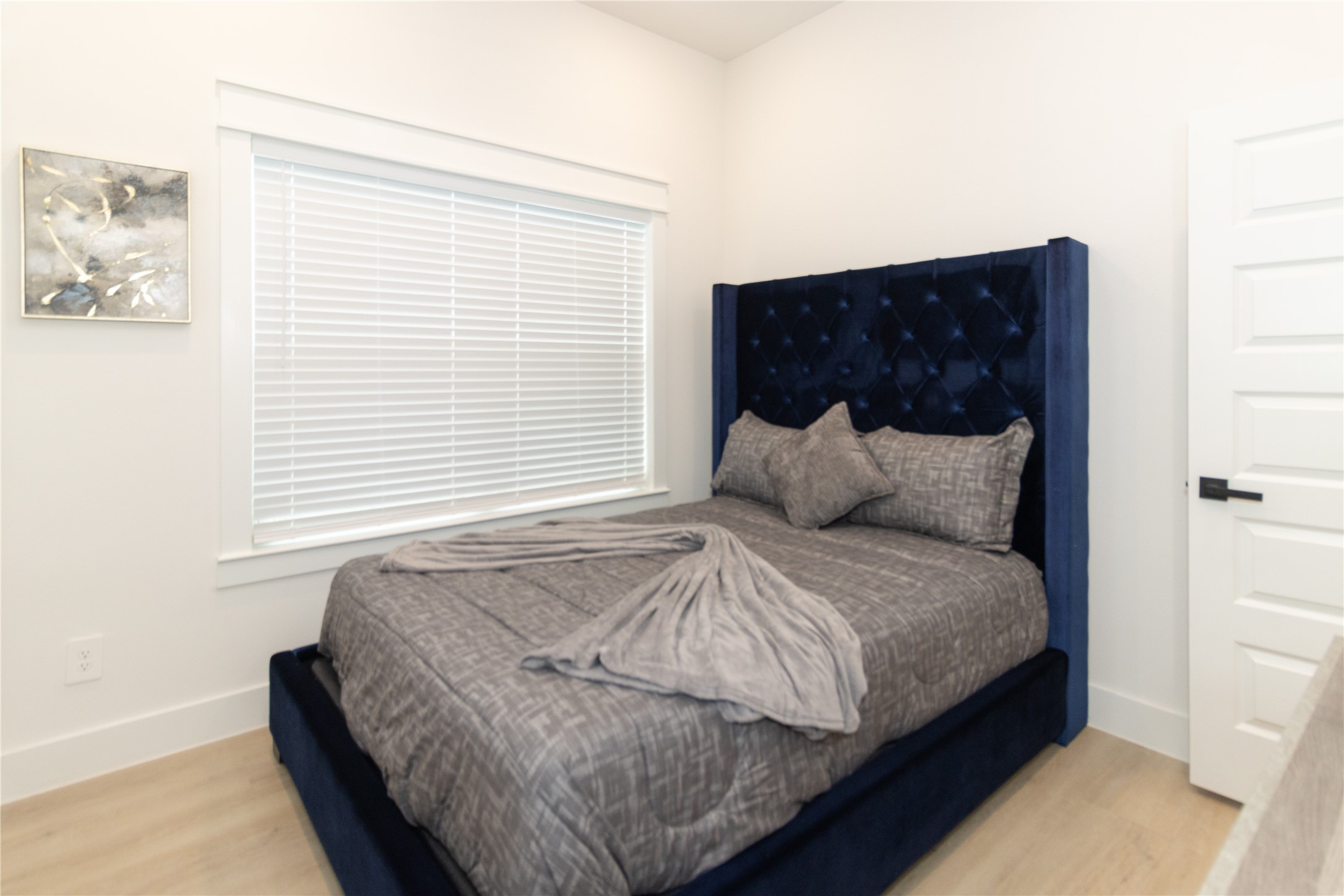 4902 Higgins Street, Unit B Houston, TX 77033 - Photo 30 of 39 a bedroom with a bed and window