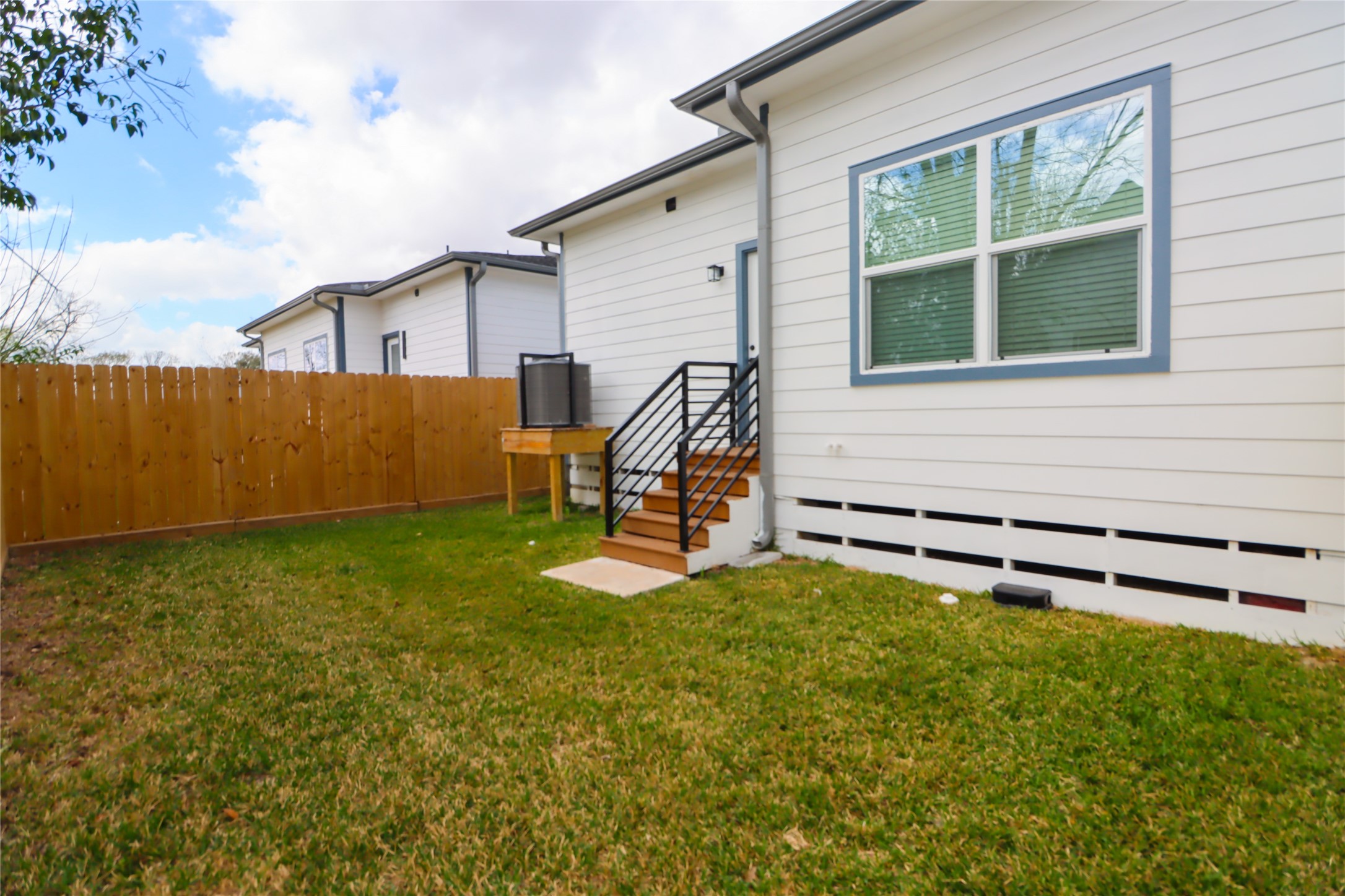 4902 Higgins Street, Unit B Houston, TX 77033 - Photo 36 of 39 a view of backyard with a chair and a garden
