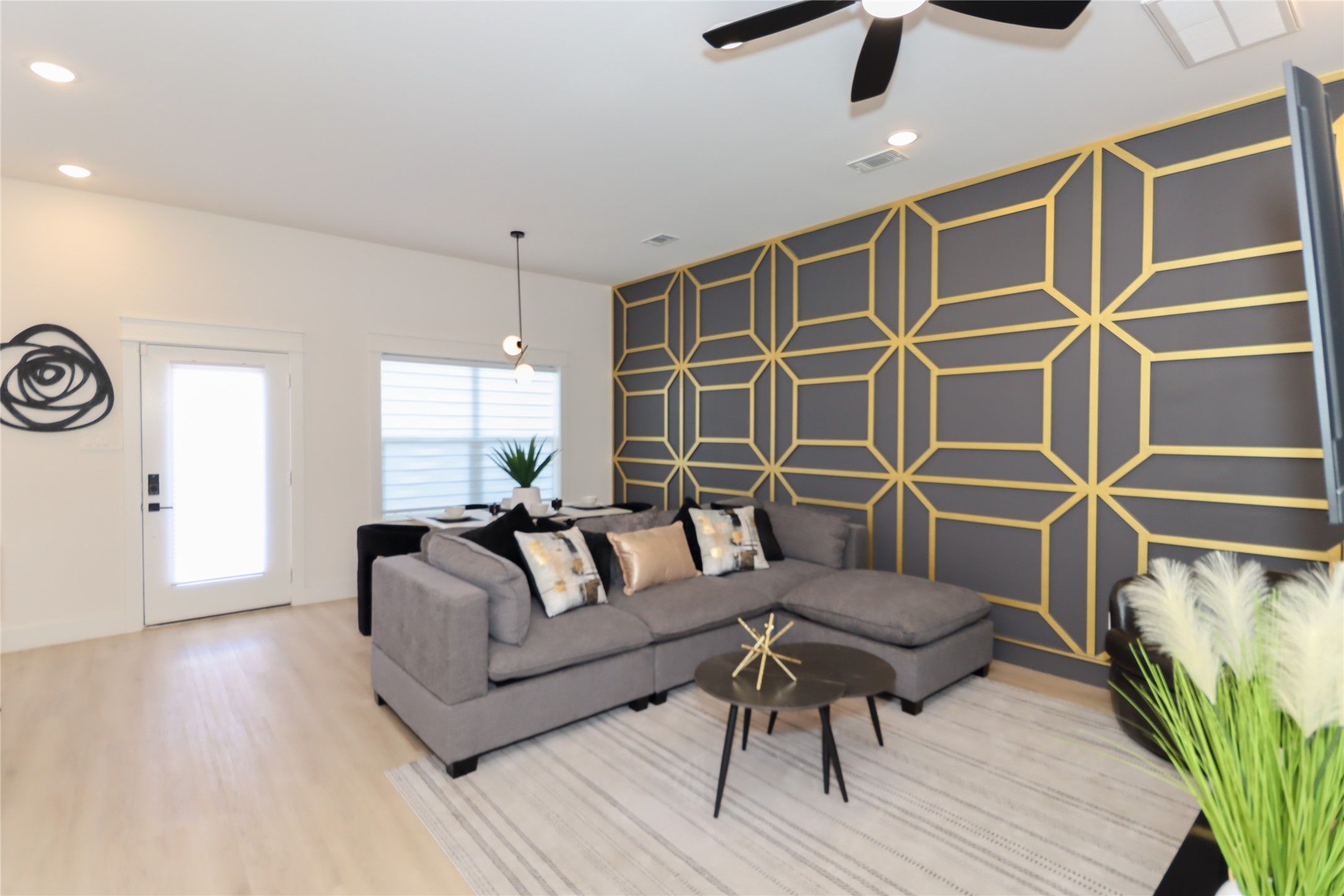 4902 Higgins Street, Unit B Houston, TX 77033 - Photo 4 of 39 a living room with furniture a ceiling fan and a rug