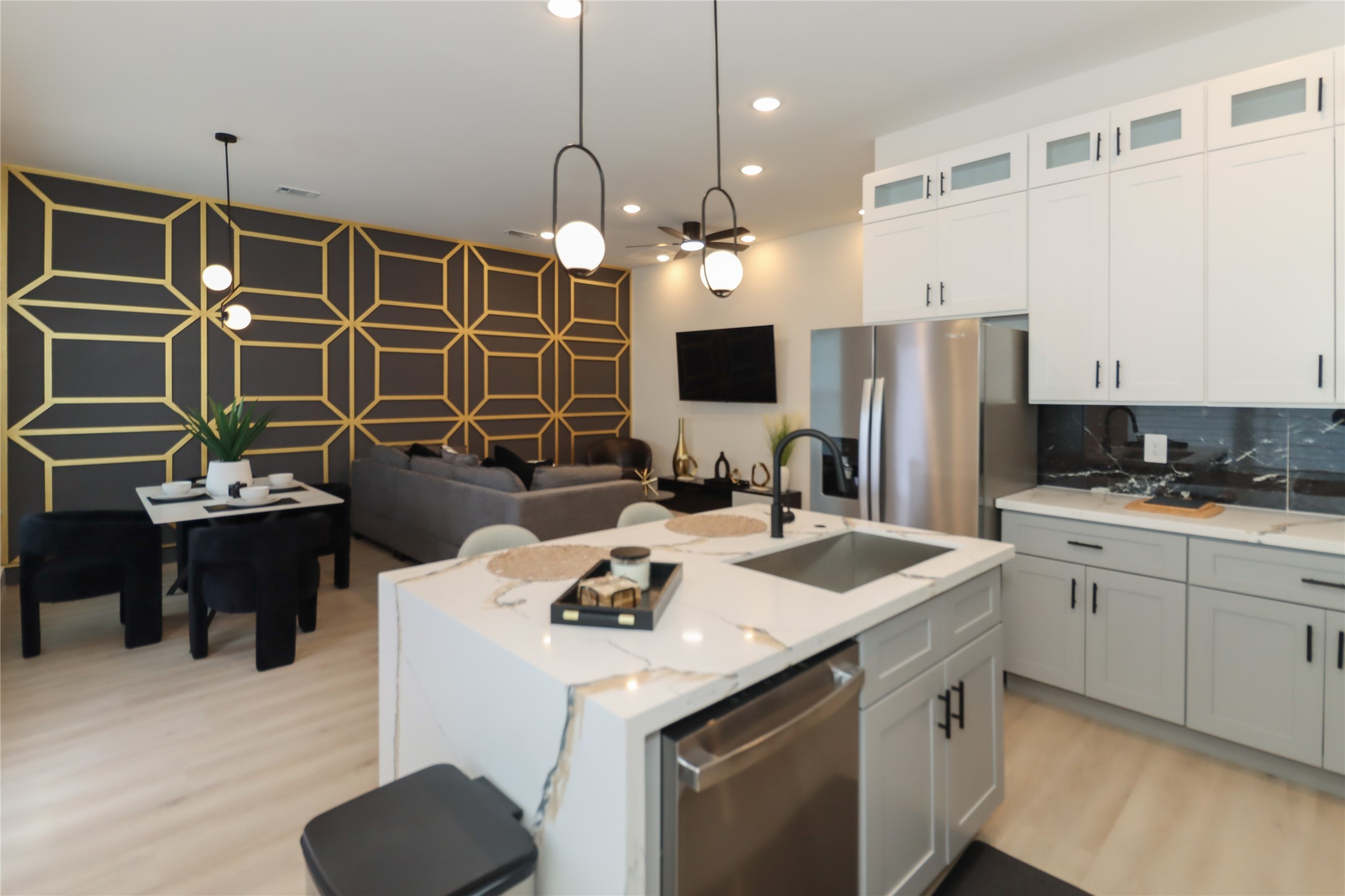 4902 Higgins Street, Unit B Houston, TX 77033 - Photo 9 of 39 a kitchen with a sink a stove and a refrigerator