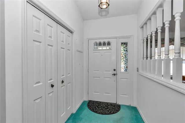 a view of a bathroom with a sink and a mirror