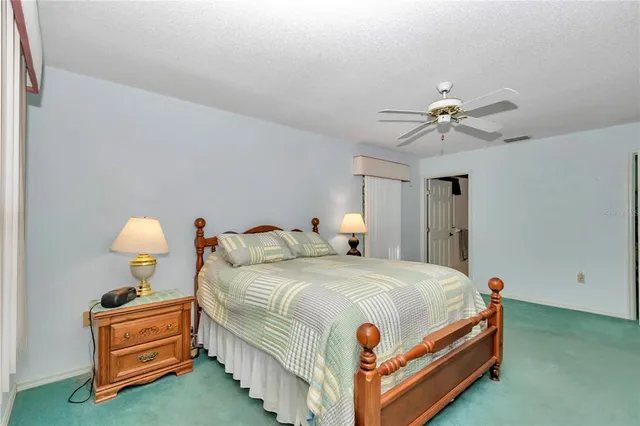 a bedroom with bed and window