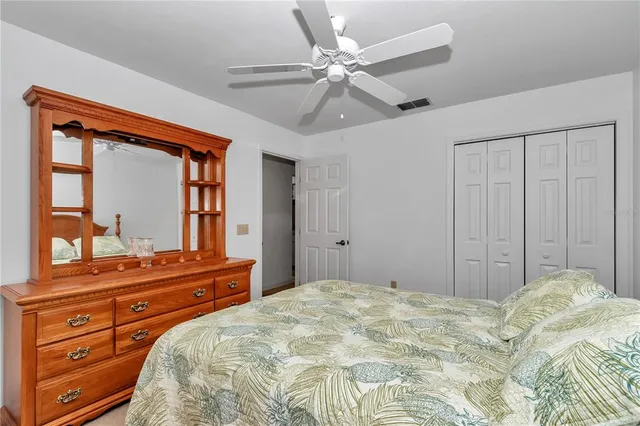 a bedroom with a bed and a dresser