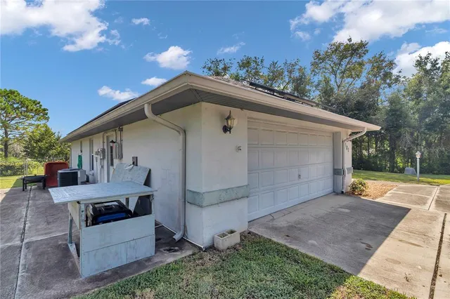 a view of backyard with barbeque grill and outdoor seating