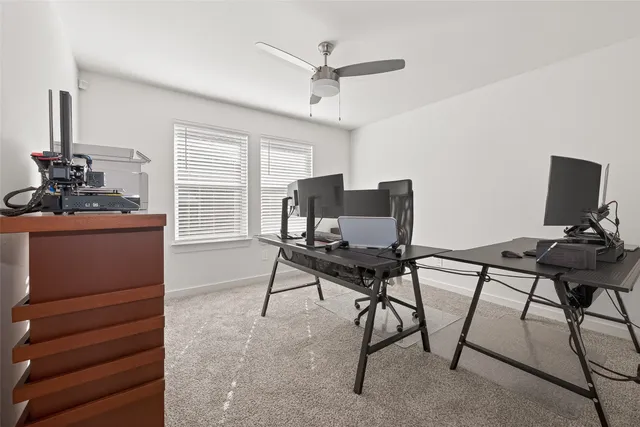 a work room with furniture and windows