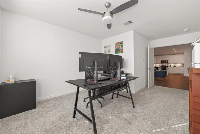 a view of a workspace with furniture