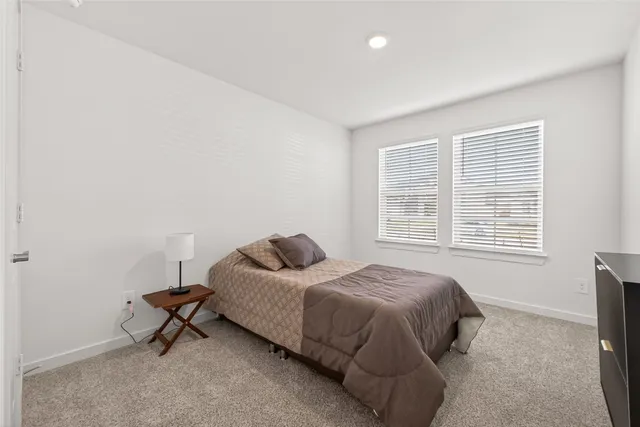 a bedroom with a bed and a cabinets