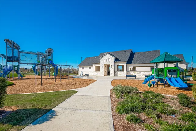 a view of a swimming pool with a lounge chair