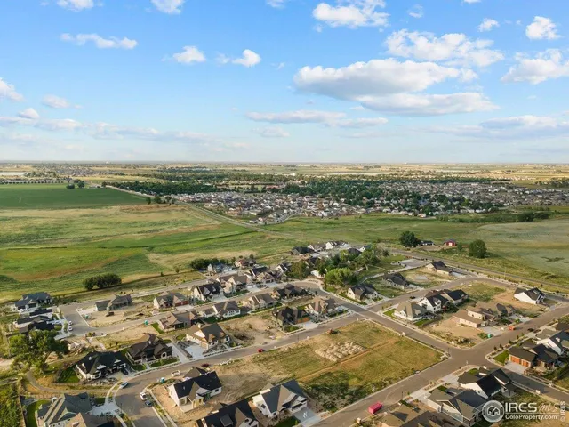 an aerial view of a city with ocean view