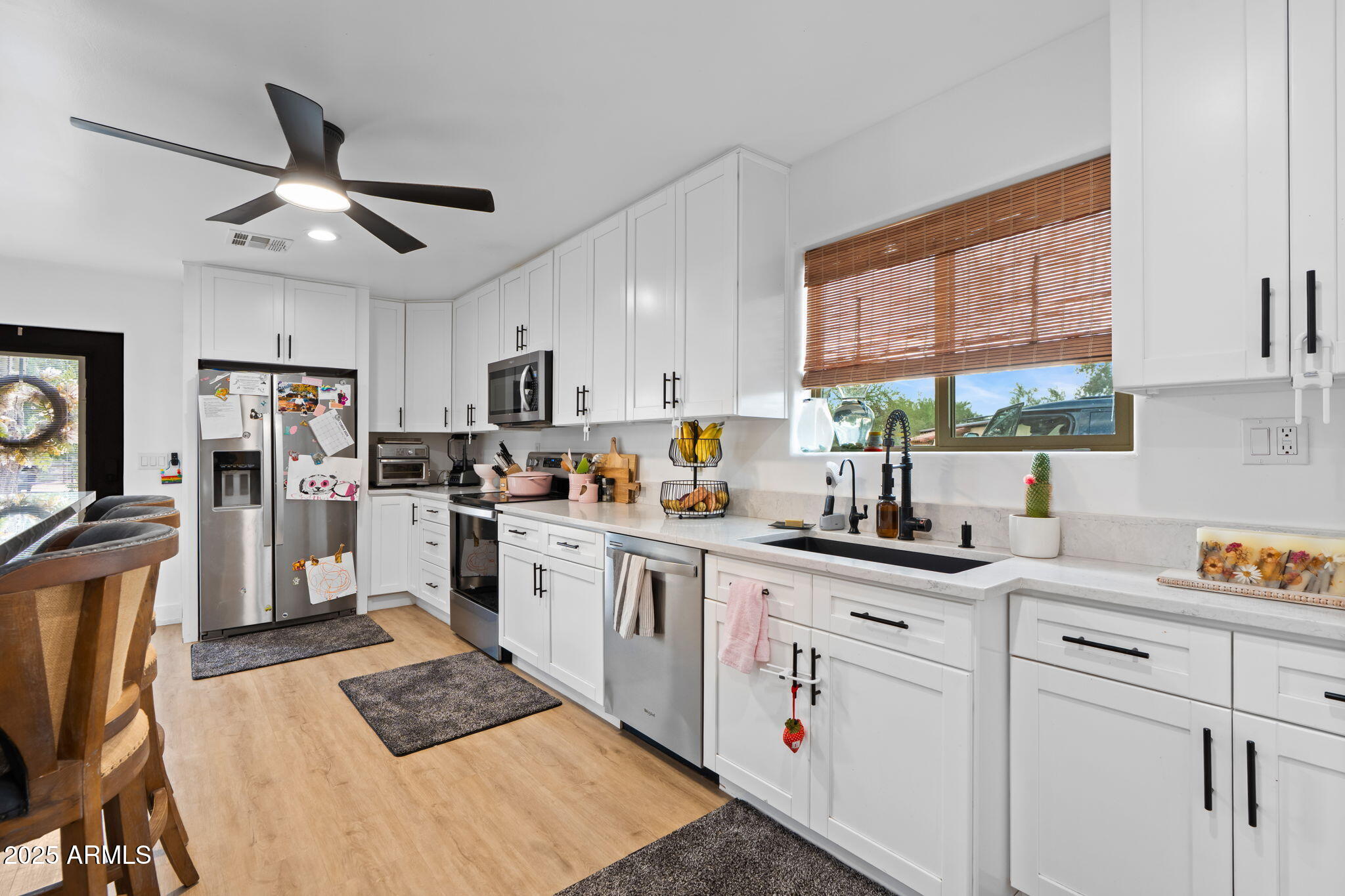 6835 East Peak View Road Scottsdale, AZ 85266 - Photo 91 of 107 a kitchen with appliances cabinets a sink and a window