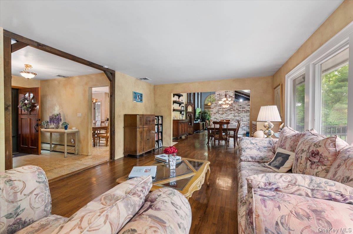 6 Apex Road Melville, NY 11747 - Photo 4 of 50 a living room with furniture and a large window
