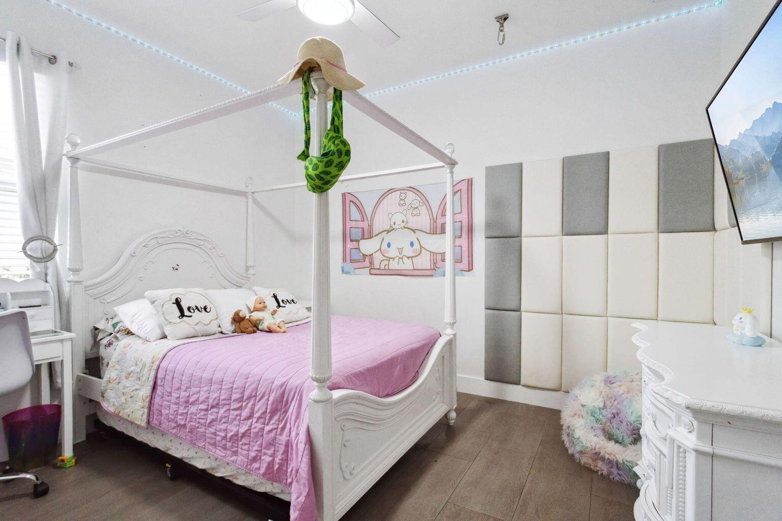 6944 2nd Street Jupiter, FL 33458 - Photo 15 of 26 a bedroom with a bed and a window