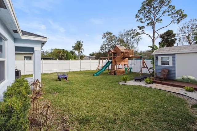 a view of backyard with a garden and entertaining space