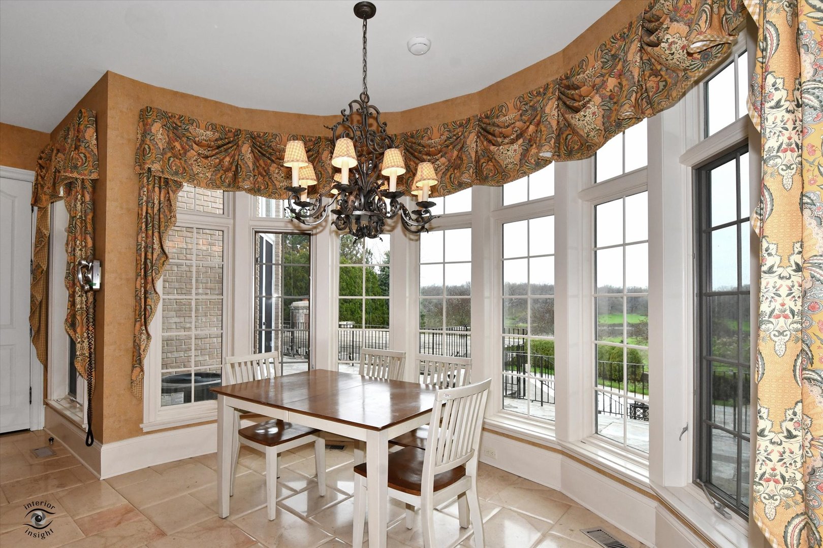 228 East Goodenow Road Beecher, IL 60401 - Photo 24 of 78 a dining room with wooden floor a chandelier a glass table and chairs