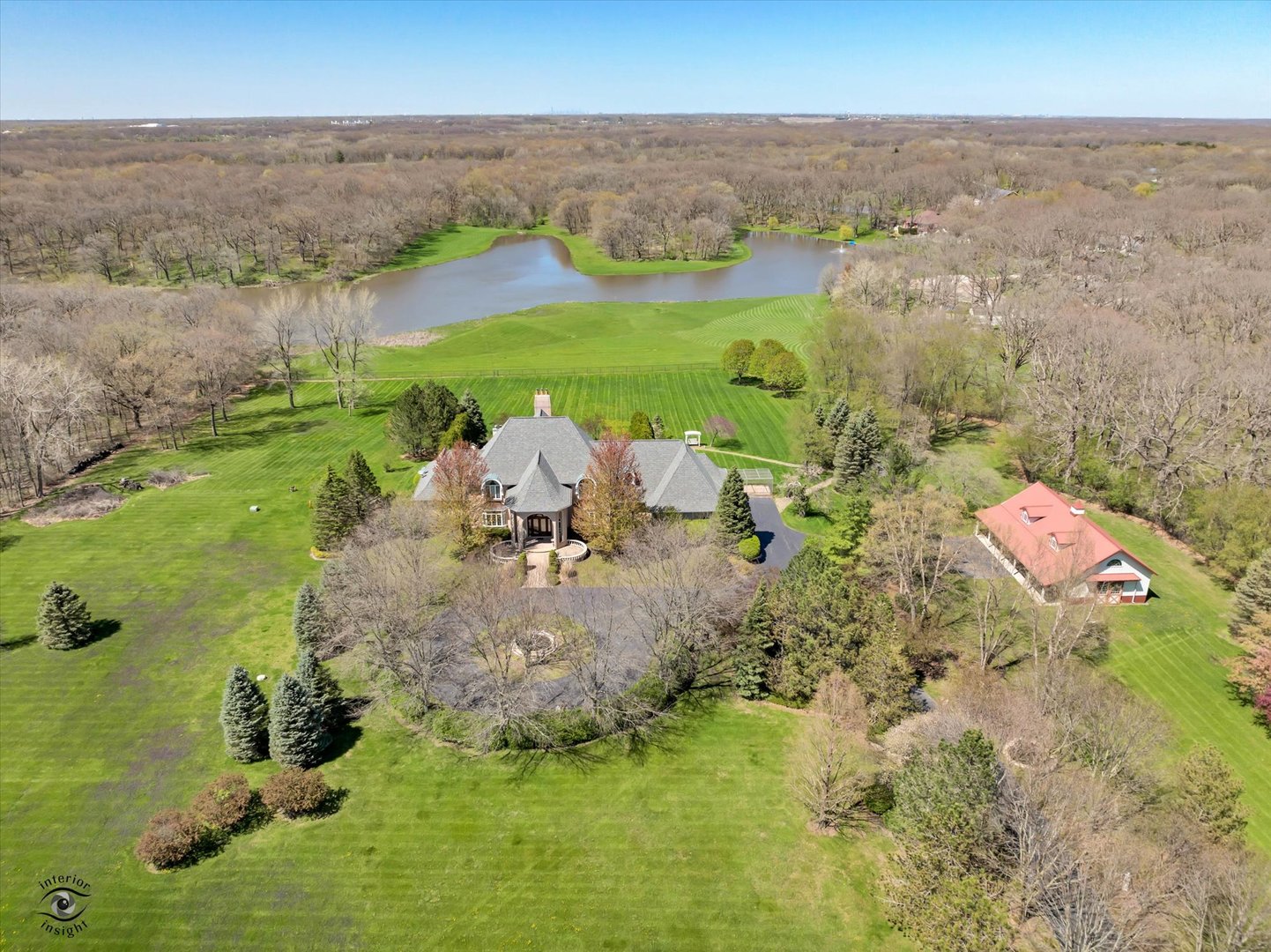228 East Goodenow Road Beecher, IL 60401 - Photo 3 of 78 a view of a lake with lawn chairs