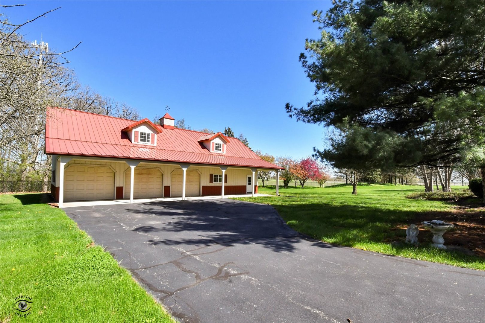228 East Goodenow Road Beecher, IL 60401 - Photo 6 of 78 a front view of a house with a yard and trees