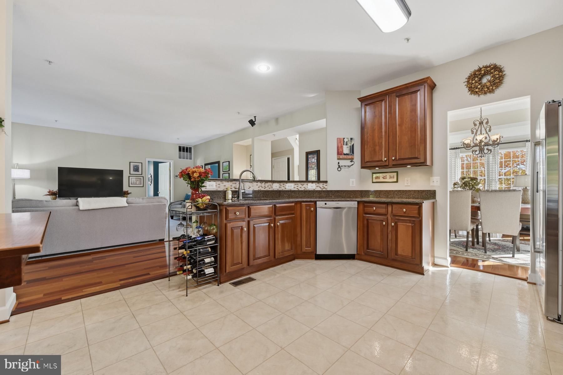 11206 Poplar Grove Court Laurel, MD 20708 - Photo 14 of 67 a view of a kitchen with furniture and a window