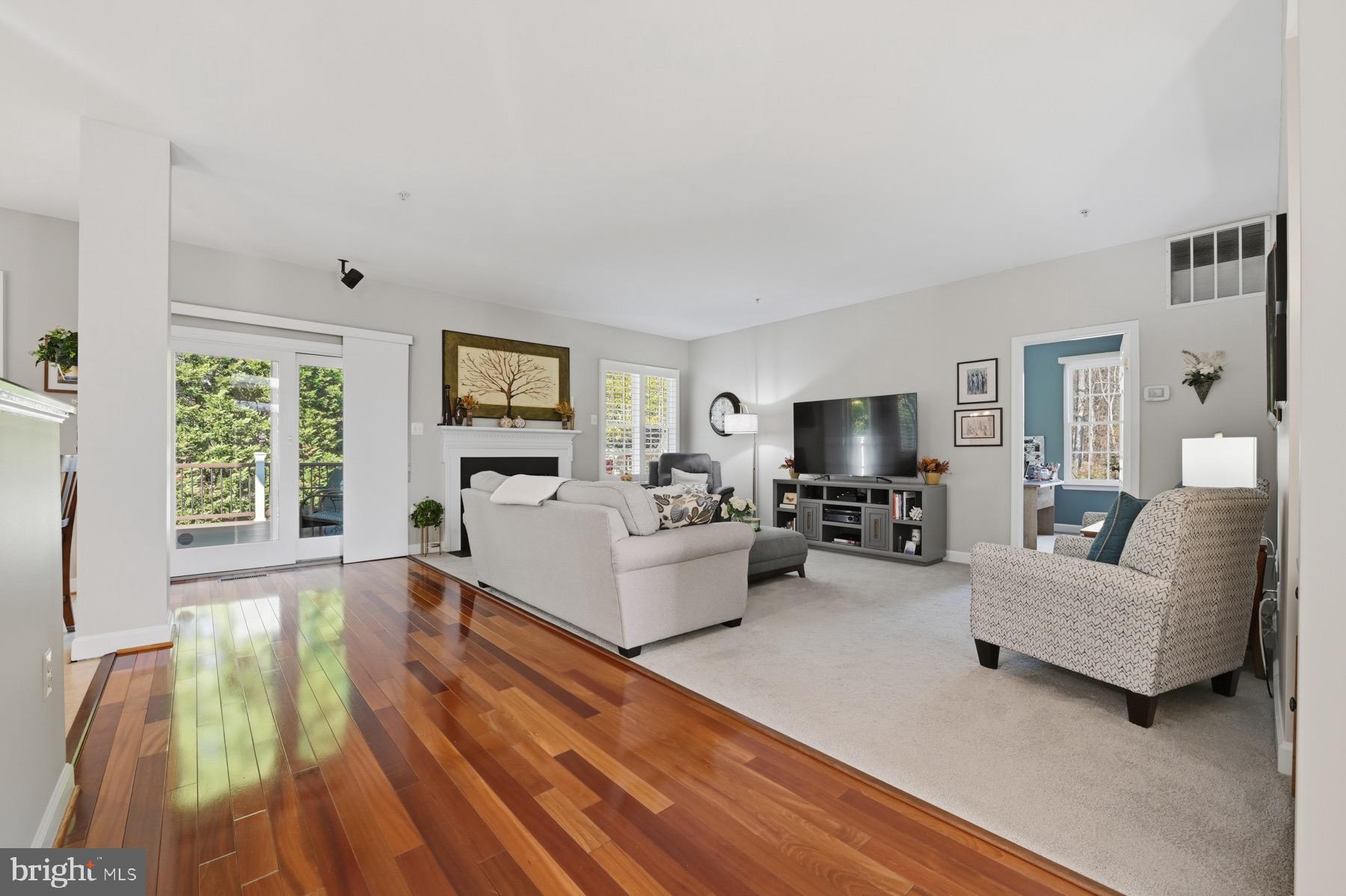 11206 Poplar Grove Court Laurel, MD 20708 - Photo 67 of 67 a living room with furniture and a flat screen tv