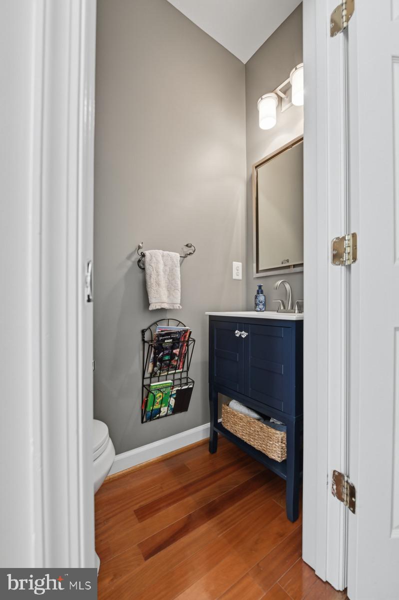 11206 Poplar Grove Court Laurel, MD 20708 - Photo 22 of 67 a bedroom with a bed and a mirror